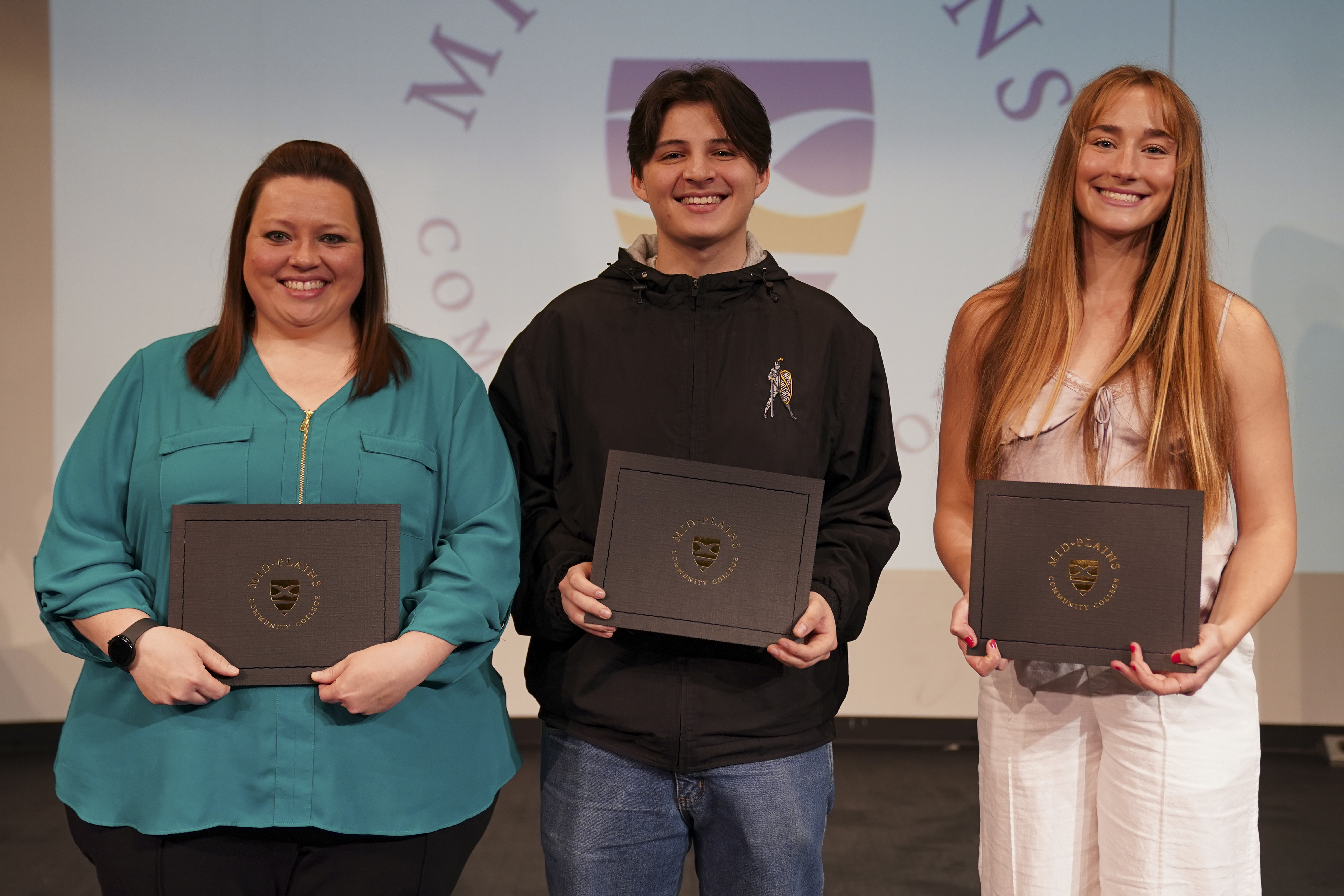 Vice President of Student Services Award winner Ashley Smolik, Vice President of Instruction Award winner Juan Zanguitu and Presidential Award recipient Reece Halley are recognized during the North Platte Community College Honors Convocation on Monday..