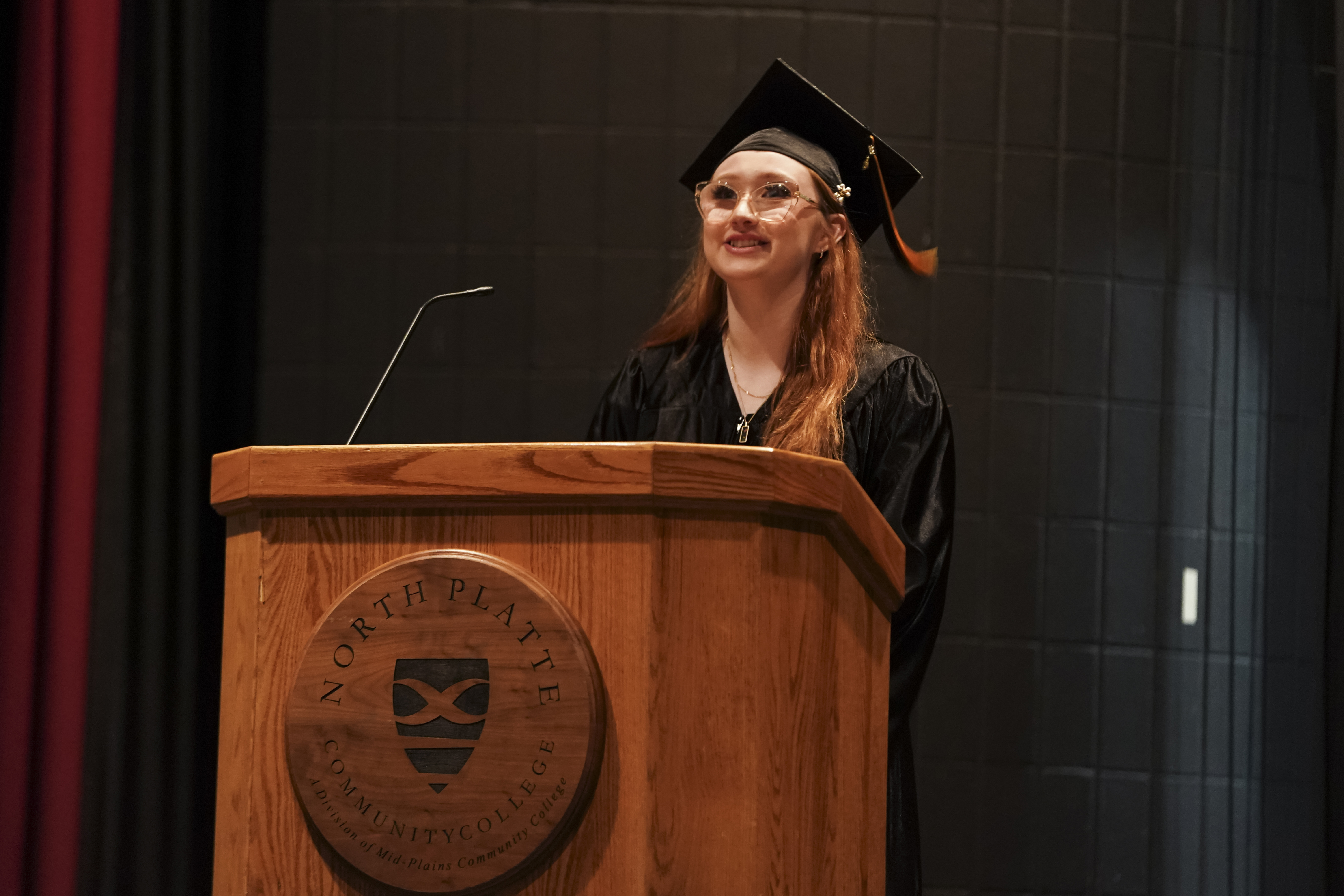 Emmajo Mahler addresses classmates, friends and family during the GED® ceremony at the McDonald-Belton Theater on Wednesday evening.