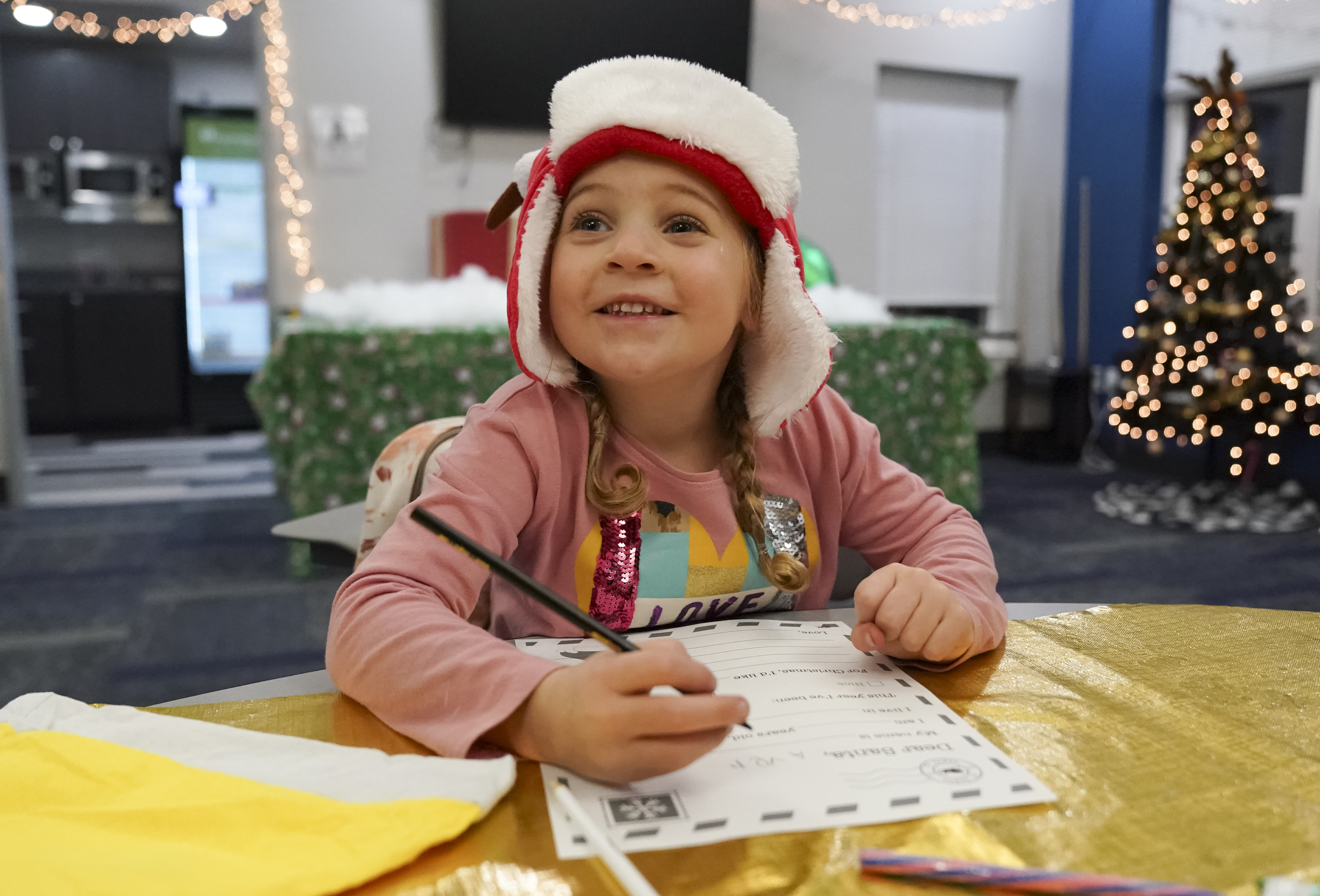 A child prepares a letter for Santa at NPCC’s Santa’s Workshop last year. This year’s event is scheduled for Dec. 3. 